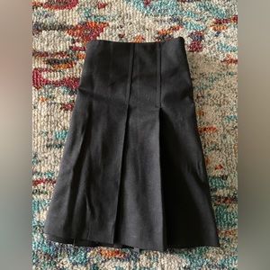 Theory Black Pleated Wool Mini Skirt similar to Taylor Swift’s